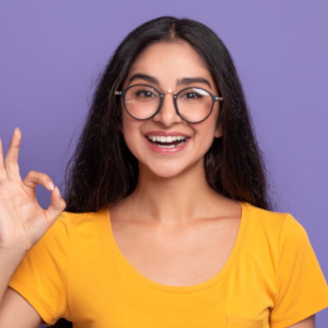 woman with glasses smiling for a website designer